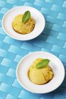 Scoops of home-made mango sorbet — Stock Photo