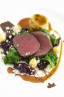Medallions of venison with kale — Stock Photo