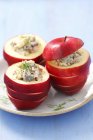 Herring and apple salads in hollowed-out apples — Stock Photo