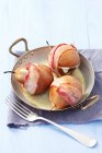 Pears wrapped in bacon — Stock Photo