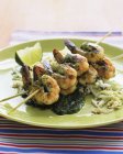 Closeup view of prawns on skewer with a lime and mint sauce — Stock Photo