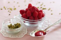Spoon of raspberry and rose jam — Stock Photo