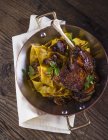 Duck leg with cabbage noodles — Stock Photo