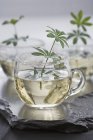 Closeup view of white wine, flavored with woodruff — Stock Photo