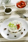 Rice cake with dried fruit and olives — Stock Photo