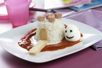 Rice fortress with tomato sauce — Stock Photo