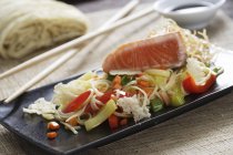 Noodles and salmon fillet — Stock Photo