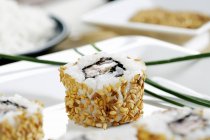 Sesame salmon sushi roll — Stock Photo