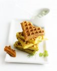 Herb waffles on plate and on table — Stock Photo