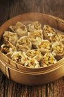 Closeup view of Dim Sum in bamboo steamer — Stock Photo