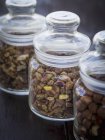Pistachio nuts in jars — Stock Photo
