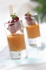 Salmorejo - creamy, cold soup with a skewer of fish in glasses — Stock Photo