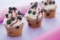 Blueberry cupcakes with icing — Stock Photo