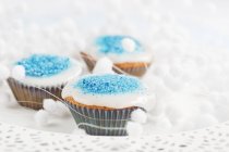 Cupcakes decorated with blue sugar — Stock Photo