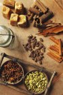 Assorted spices on a wooden table — Stock Photo