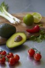 Ingredients for guacamole on wooden desk — Stock Photo