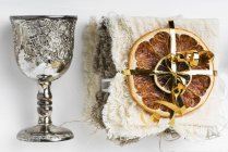 Closeup top view of dried fruits and a silver goblet as Christmas decorations — Stock Photo