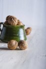 Walnuts in a ceramic jug — Stock Photo