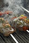 Beef steaks being barbecued — Stock Photo