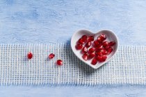 Pomegranate seeds in bowl — Stock Photo