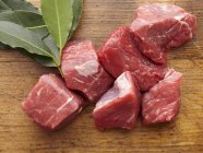 Chunks of Raw Beef and Bay Leaves — Stock Photo