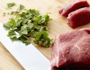 Raw Beef and Chopped Cilantro — Stock Photo