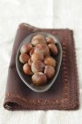 Chestnuts in metal dish — Stock Photo