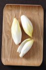 Chicory on a wooden tray — Stock Photo