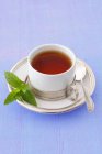 Cup of peppermint tea — Stock Photo
