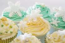 Cupcakes decorated with yellow and green icing — Stock Photo
