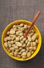Tiger nuts in yellow bowl — Stock Photo
