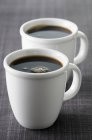 Tazze di caffè nero — Foto stock
