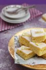 Closeup view of stacked lemon pie slices dusted with icing sugar — Stock Photo