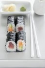Maki sushi with tuna, salmon and cucumber — Stock Photo