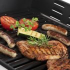 Pork steaks on grill — Stock Photo