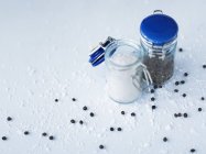 Salt and pepper in pots — Stock Photo