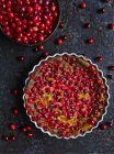 Top view of cranberry clafoutis and fresh cranberries — Stock Photo