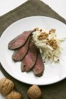 Venison meat with Waldorf salad — Stock Photo