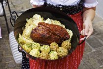Close up of Roast pork in the tin with pointed cabbage and dumplings (Austria) — Stock Photo