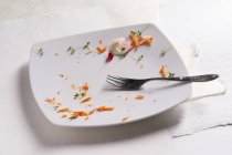 Remains of carrots and cress — Stock Photo