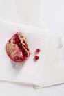 Chunk of pomegranate and seeds — Stock Photo