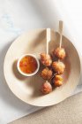 Fish balls with sweet and sour sauce — Stock Photo