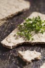 Crispbread with cress on wooden — Stock Photo