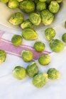 Brussel sprouts on towel — Stock Photo
