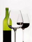 Wine glasses and bottle of wine — Stock Photo