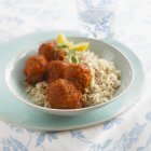 Meatballs with boiled rice — Stock Photo