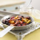 Closeup view of fried peaches and plums — Stock Photo
