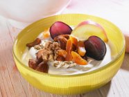 Quark muesli with fruits and nuts — Stock Photo