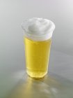 Lager in a plastic cup — Stock Photo