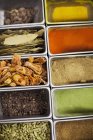 Top view of assorted herbs and spices in containers — Stock Photo